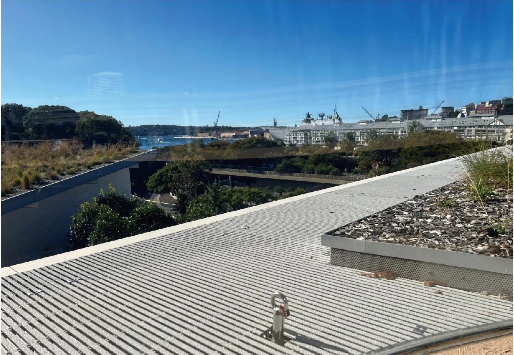 Open pultruded FRP grating installed as a rooftop walkway